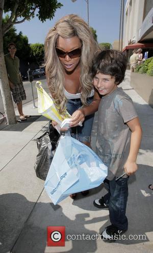 Wendy Williams waliking down Roberts Blvd with a plaster on her left knee, on her way to Kitson after having...