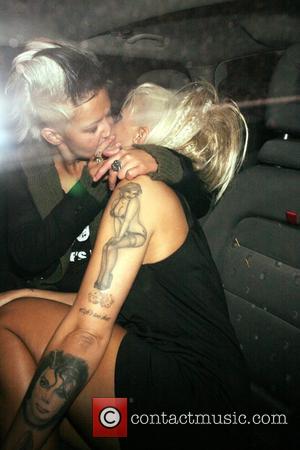 Jodie Marsh and her girlfriend Nina kiss in the back of a taxi after leaving Chinawhite nightclub London, England -...