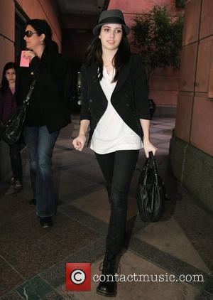 Emma Roberts at a medical center in Beverly Hills wearing a Trilby hat and Dr. Martens boots. Los Angeles, California,...