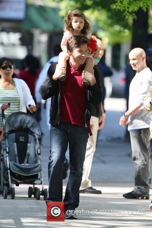 Jason Bateman carries his daughter, Francesca, on his shoulders while on break at the film set of his new movie...