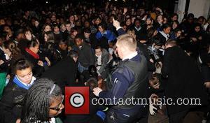 FANS IN JLS-TASY OVER X FACTOR BOYS Steady on girls... In scenes reminiscent of Beatlemania, more than a thousand screaming...