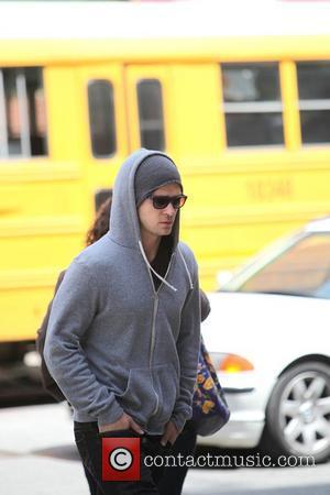 Justin Timberlake wearing a grey hoodie and sunglasses walking in SoHo New York City, USA - 11.05.09