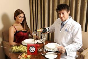 Lucy Pinder and EST's energy love Doctor Rob Bell pose for Valentines Day.  Half of all Brits will not...