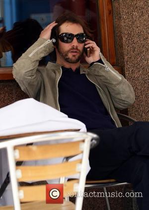 Jason Kay aka J.K. Of Jamiroquai sits outside a cafe on the Portobello road London, England - 08.05.