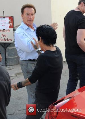 Governor of California Arnold Schwarzenegger makes his way home after having lunch at Mulberry Street Pizzeria with some friends. The...