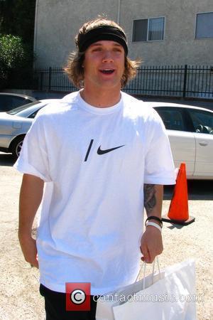 American professional snowboarder Louie Vito arrives for 'Dancing with the Stars' rehearsals carrying a shopping bag Los Angeles, California -...