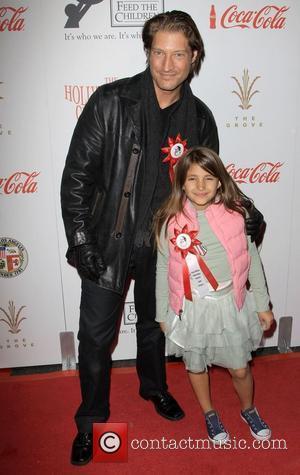 Sean Kanan and Guest The 2009 Hollywood Christmas Parade/Live Positively Presented by Coca-Cola held on Hollywood Boulevard Hollywood, California -...