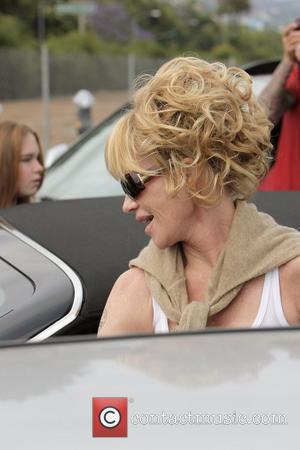 Melanie Griffith and her two daughters leaving Neil George salon in Beverly Hills Los Angeles, California - 11.06.09
