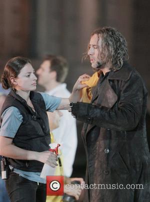 Nicolas Cage and Monica Bellucci film a romantic scene in The Sorcerer's Apprentice at a park in Manhattan. BSC.MWD.ZO7