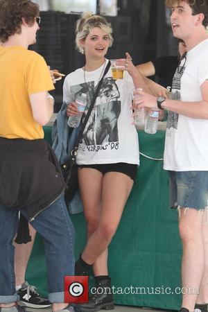 Pixie Geldof wearing a sexually explicit t-shirt and with a pint of beer at the 2010 Coachella Valley Music and...