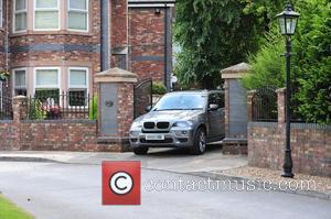 A car leaving Coleen Rooney's parents house. It is rumoured she remains inside the property following revelations about her husband's...