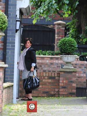 Colette McLoughlin, mother of Coleen Rooney, outside her house. It is rumoured her daughter remains inside the property following revelations...