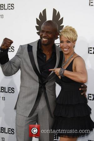 Terry Crews and Guest Los Angeles Premiere of 'The Expendables' held at Grauman's Chinese Theatre  Los Angeles, California -...