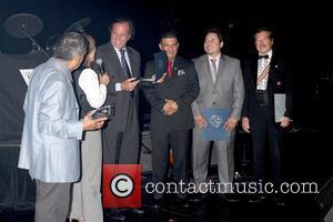 Julio Iglesias (3rd L) receives the 'Maximum Hispanic Pride' award from the Las Vegas International Press Association and named today...