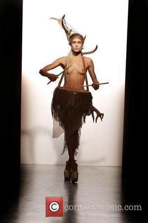 Model Alice Dellal, topless and playing a drum London Fashion Week Spring/Summer 2011 - Pam Hogg - Catwalk. London, England...