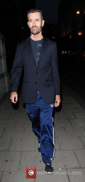 Rupert Everett in tracksuit bottoms and jacket arriving at the Martina Rink book launch of 'Isabella Blow' held at the...