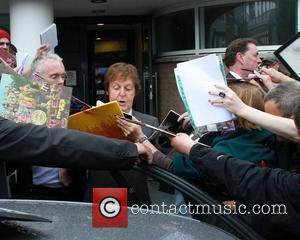 Sir Paul McCartney is mobbed by fans as he leaves the LIPA Graduation ceremony at the Philharmonic Hall.  Liverpool,...