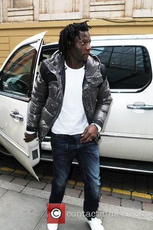 Manchester City Striker Benjani Mwaruwari Leaving The Radisson Edwardian Hotel