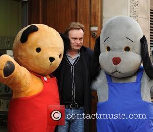 Philip Glenister outside the BBC Radio 1 studios with U.K. TV characters Sooty and Sweep  London, England - 01.04.10