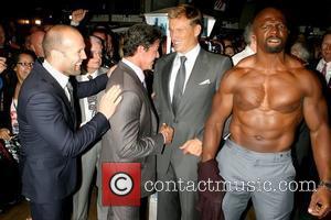 Jason Statham, Sylvester Stallone, Dolph Lundgren and Terry Crews, who took of his shirt for photographers The cast of 'The...