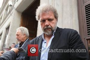 Tom Jones and his son Mark Woodward outside the BBC Radio One studios London, England - 27.07.10