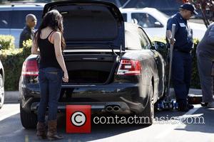 Vanessa Hudgens returns to her car after shopping, to find it has a flat tire.  Los Angeles, California -...