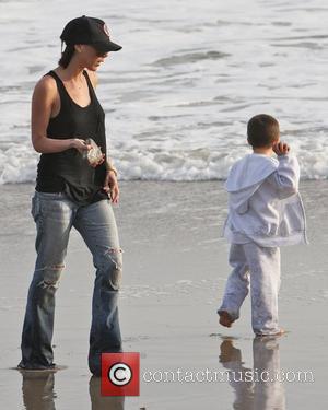 Victoria Beckham and Cruz Beckham playing on the beach Malibu, USA - 31.01.10