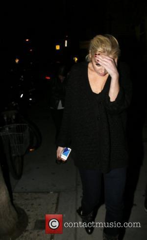 Lindsay Lohan hides her face as she leaves Wabi-Sabi restaraunt in Venice Beach. enjoying her last days of freedom The...