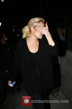 Lindsay Lohan hides her face as she leaves Wabi-Sabi restaraunt in Venice Beach. enjoying her last days of freedom The...