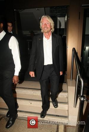 Richard Branson leaving his party at the Kensington Roof Gardens London, England - 21.04.11