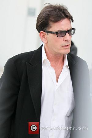 Charlie Sheen  continues on his whirlwind media tour and stops on the roof of the Live Nation office to...