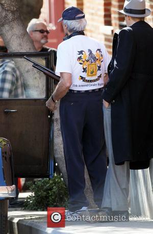 Clint Eastwood carries a rifle on the set of his new film 'J. Edgar' Los Angeles, California - 11.02.11