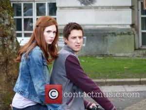 Arthur Darvill and Karen Gillan ride on a motorcycle on the set of the BBC sci-fi series Doctor Who filming...