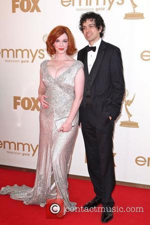 Christina Hendricks and Geoffrey Arend, at the 63rd Primetime Emmy Awards, held at Nokia Theatre L.A. LIVE - Arrivals Los...