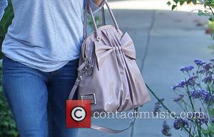 Eva Longoria departs the Ken Paves salon in West Hollywood carrying a pink Valentino handbag Los Angeles, California - 13.10.11