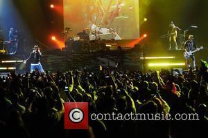 Axl Rose, Guitarist/ songwriter Dj Ashba of Guns N' Roses performs at the American Airlines Arena during his North American...