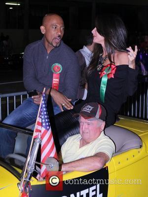 Montel Williams and Guest The 80th Anniversary of The Hollywood Christmas Parade benefiting Marine Toys For Tots on Hollywood Boulevard...