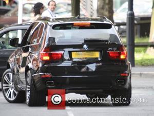 Jack P. Shepherd's BMW appears to have a nasty dent on the back bumper Coronation Street cast members outside the...