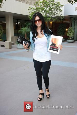 Kim Lee leaves The Newsroom on Robertson Boulevard with the script for The Dead Cage after meeting with director Chris...