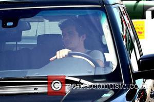 Orlando Bloom drove his car to the back entrance of M Cafe in West Hollywood to pick up his wife...