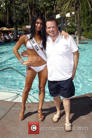 Miss USA 2011 Rima Fakih with an illusion by Nathan Burton at The 2011 Miss USA Contestants Flamingo Pool Party...