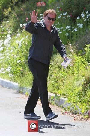 Quentin Tarantino goes to Cafe Med restaurant on Sunset Plaza. When leaving, Quentin is seen holding a brochure for a...