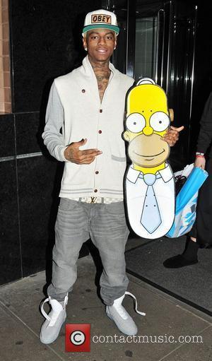 Soulja Boy arrives at his midtown hotel with a Homer Simpson skateboard New York City, USA - 31.10.11