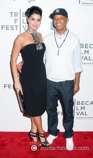 Rima Fakih and Russell Simmons  2011 Tribeca Film Festival Premiere of 'Last Night' at the BMCC Theater - Arrivals...