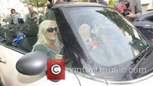 Vanessa Feltz driving her convertible Mini Cooper in St. John's Wood London, England - 09.10.11