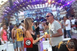 Lord Baltimore designer Christian Audigier and his girlfriend Nathalie Sorensen attend Dj Luciano's Vagabundos open air party at Ushuaia Ibiza,...