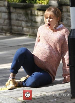 Rachel McAdams films a scene where she goes into labour on the famous Abbey Road zebra crossing  on the...