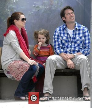 Alyson Hannigan and her husband Alexis Denisof sit with their daughter Satyana whilst out and about in Venice Los Angeles,...