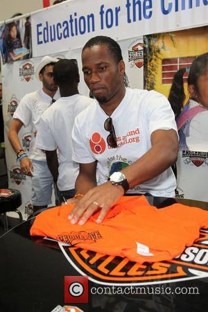 Didier Drogba Professional football players from the English Premier League host an event at Eaglerider Motorcycles in support of 'armsaroundthechild.org'...