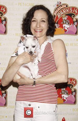 Bebe Neuwirth holds Chachi, a dog up for adoption Broadway Barks: The 14th Annual Dog and Cat Adopt-a-thon held in...